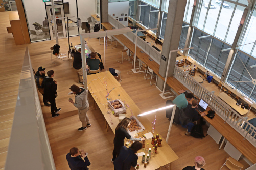 People enjoying Mayday treats at Demoday spring 2025.