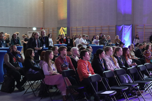 People listening to the guest speakers in Game Track 2025.